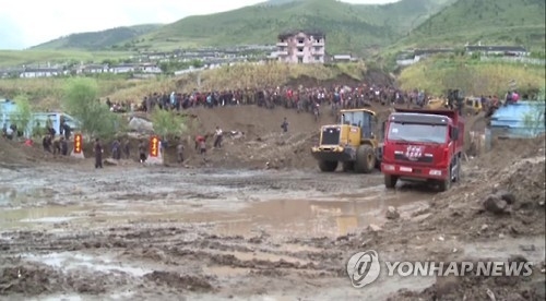This image captured by footage from North Korea's state TV station on Sept. 16, 2016, shows North Korea's efforts to recover from massive floods that hit the country's northeastern province. (For Use Only in the Republic of Korea. No Redistribution) (Yonhap)