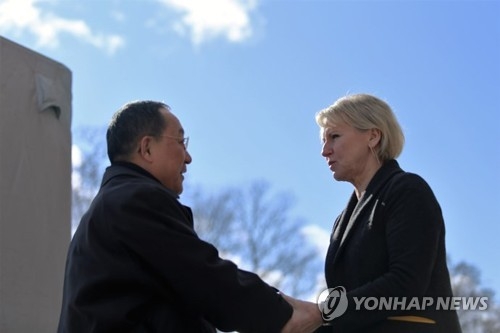 This photo provided by the Swedish Ministry for Foreign Affairs shows North Korean Foreign Minister Ri Yong-ho (L) shaking hands with his Swedish counterpart, Margot Elisabeth Wallstrom, ahead of a meeting in Stockholm on March 16, 2018. (Yonhap)