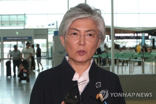 Foreign Minister Kang Kyung-wha speaks to the press before departing for Singapore at Incheon International Airport, west of Seoul, on July 31, 2018. (Yonhap)