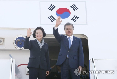 In this file photo, taken on April 23, 2019, President Moon Jae-in and First Lady Kim Jung-sook leave for South Korea after visiting Kazakhstan. (Yonhap)
