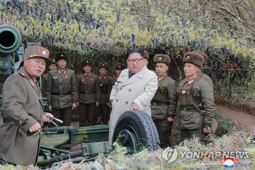 North Korean leader Kim Jong-un (C) talks with soldiers during a visit to a defense detachment on Changrin Islet near the western sea border with South Korea, in this photo provided by the Korean Central News Agency on Nov. 25, 2019. The agency stopped short of reporting when he made the visit. (For Use Only in the Republic of Korea. No Redistribution)