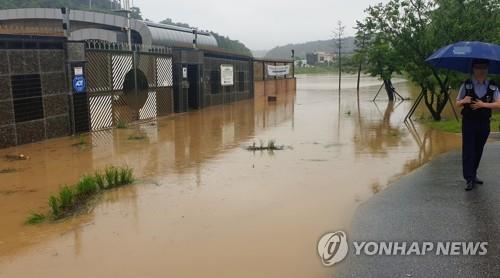 A farming facility is flooded on the outskirts of Gangneung, Gangwon Province, on June 30, 2020, after the area was hit by heavy downpours and strong winds. (Yonhap)
