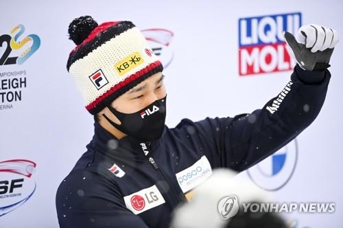 This EPA photo shows South Korean skeleton slider Yun Sung-bin celebrating on the podium after finishing third in the IBSF World Cup men's skeleton event in St. Moritz, Switzerland, on Jan. 15, 2021. (PHOTO NOT FOR SALE) (Yonhap)
