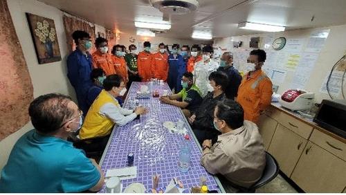 In this photo provided by Seoul's foreign ministry on Feb. 4, 2021, officials from the South Korean Embassy in Iran meet with the crew members detained aboard the Korean-flagged MT Hankuk Chemi oil tanker that has been seized by Iran since early last month. The meeting came a day after Tehran announced it will allow the sailors to leave the ship, except for the captain for management reasons. It remains unclear how many of them have expressed a desire to leave the ship. (PHOTO NOT FOR SALE) (Yonhap)