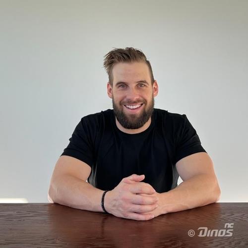 Nick Martini, a new outfielder for the NC Dinos, smiles after signing a deal with the Korea Baseball Organization club, in this photo provided by the Dinos on Dec. 21, 2021. (PHOTO NOT FOR SALE) (Yonhap)