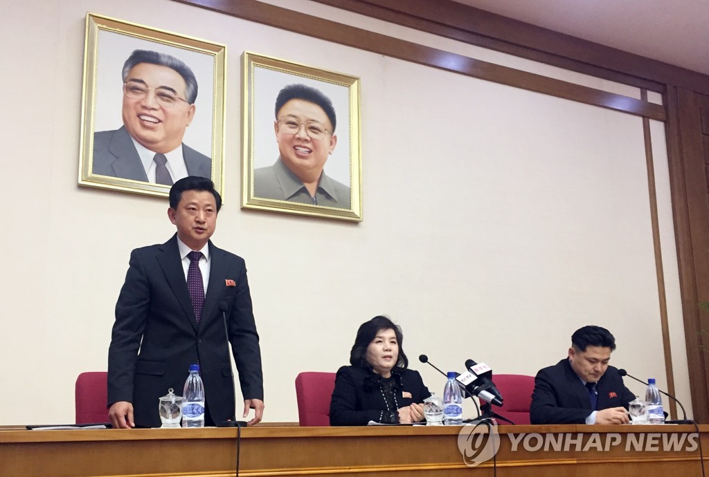This AP photo shows North Korean Vice Foreign Minister Choe Son-hui (C) speaking to diplomats in Pyongyang on March 15, 2018, flanked by her interpreter (R) and another ministry official. (Yonhap)
