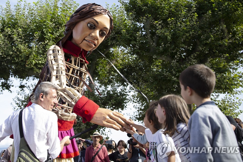 SWITZERLAND GIANT PUPPET AMAL REFUGEE