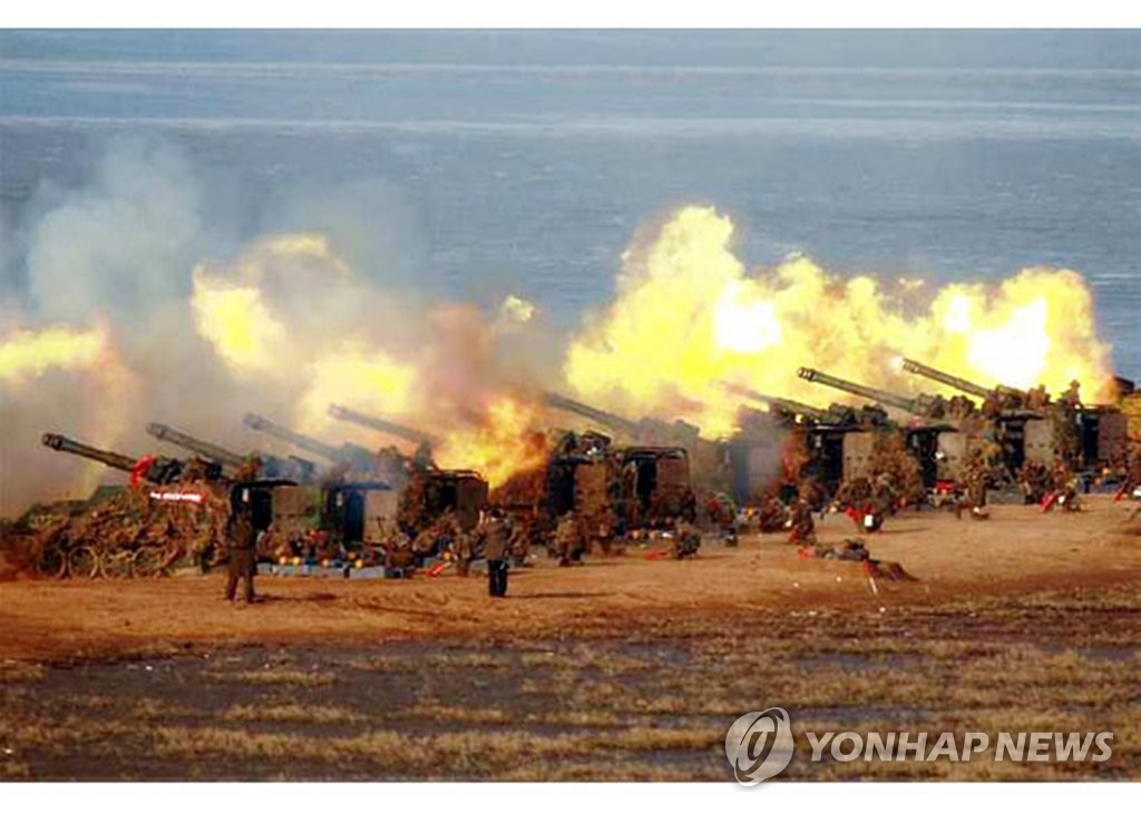 This photo released on March 21, 2020, by the Rodong Sinmun, the North's official newspaper, shows North Korean soldiers engaging in an artillery fire drill held a day earlier. (PHOTO NOT FOR SALE. No Redistribution) (Yonhap)