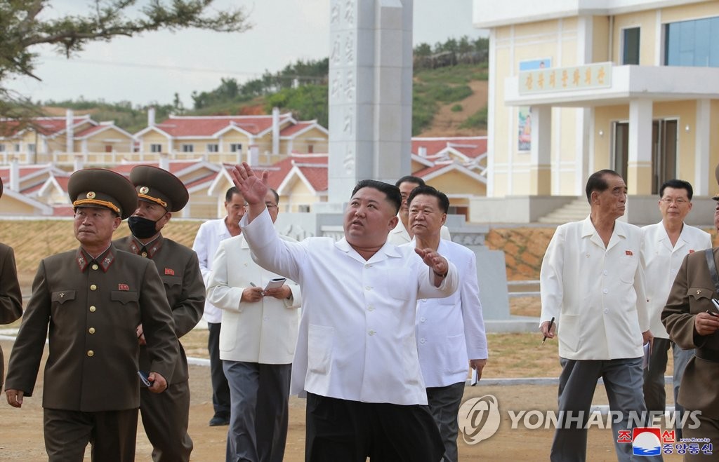 North Korean leader Kim Jong-un (C, front) inspects Kangbuk-ri, Kumchon County, North Hwanghae Province that was rebuilt from the damage by heavy rain and strong wind caused by Typhoon Bavi last month, in this undated photo released by the North's official Korean Central News Agency on Sept. 15, 2020. (For Use Only in the Republic of Korea. No Redistribution) (Yonhap)