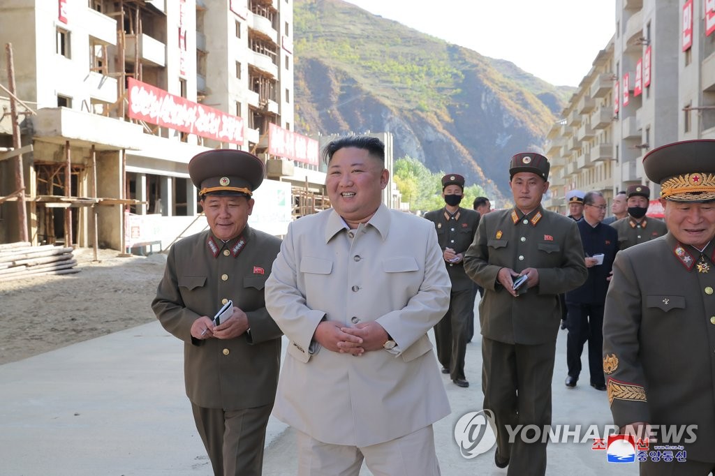This photo, provided by the Korean Central News Agency on Oct. 14, 2020, shows North Korean leader Kim Jong-un (in white clothes) inspecting a rehabilitation site in the Komdok area of South Hamgyong Province, which was hit hard by Typhoon Maysak early last month. (For Use Only in the Republic of Korea. No Redistribution) (Yonhap)