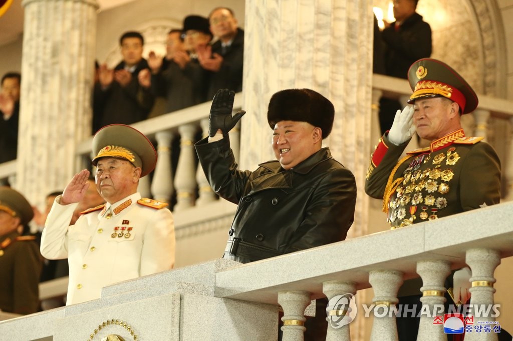 North Korean leader Kim Jong-un (C) acknowledges the crowd during a military parade at Kim Il-sung Square in Pyongyang on Jan. 14, 2021, to celebrate the recently-concluded eighth congress of the North's ruling Workers' Party, in this photo released by the North's official Korean Central News Agency the next day. (For Use Only in the Republic of Korea. No Redistribution) (Yonhap)