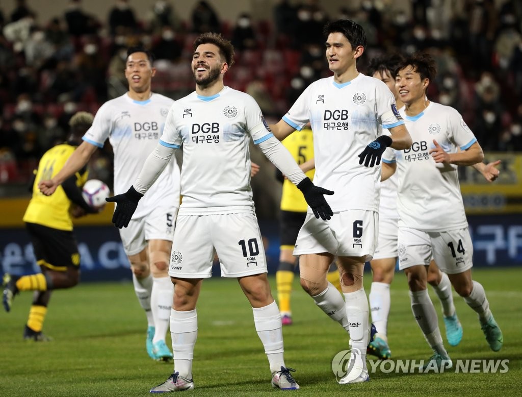 Bruno Lamas of Daegu FC (C) celebrates his goal against Jeonnam Dragons during the opening leg of the FA Cup final at Gwangyang Football Stadium in Gwangyang, South Jeolla Province, on Nov. 24, 2021. (Yonhap)