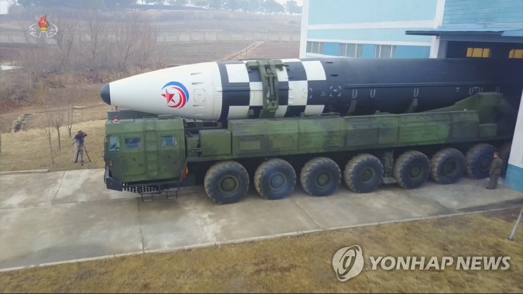A North Korean intercontinental ballistic missile (ICBM) is moved from storage for a test at Pyongyang International Airport on March 24, 2022, in this photo captured from the North's Central TV on March 25. (For Use Only in the Republic of Korea. No Redistribution) (Yonhap)