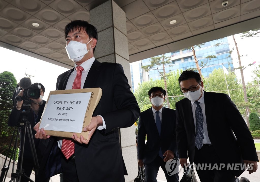 Lawyers from LKB & Partners representing South Korean investors in two main tokens of Terraform Labs head to the Seoul Southern District Prosecutors Office on May 19, 2022, to file complaints against Do Kwon, the embattled cryptocurrency firm's co-founder and CEO, and co-founder Daniel Shin. (Yonhap)