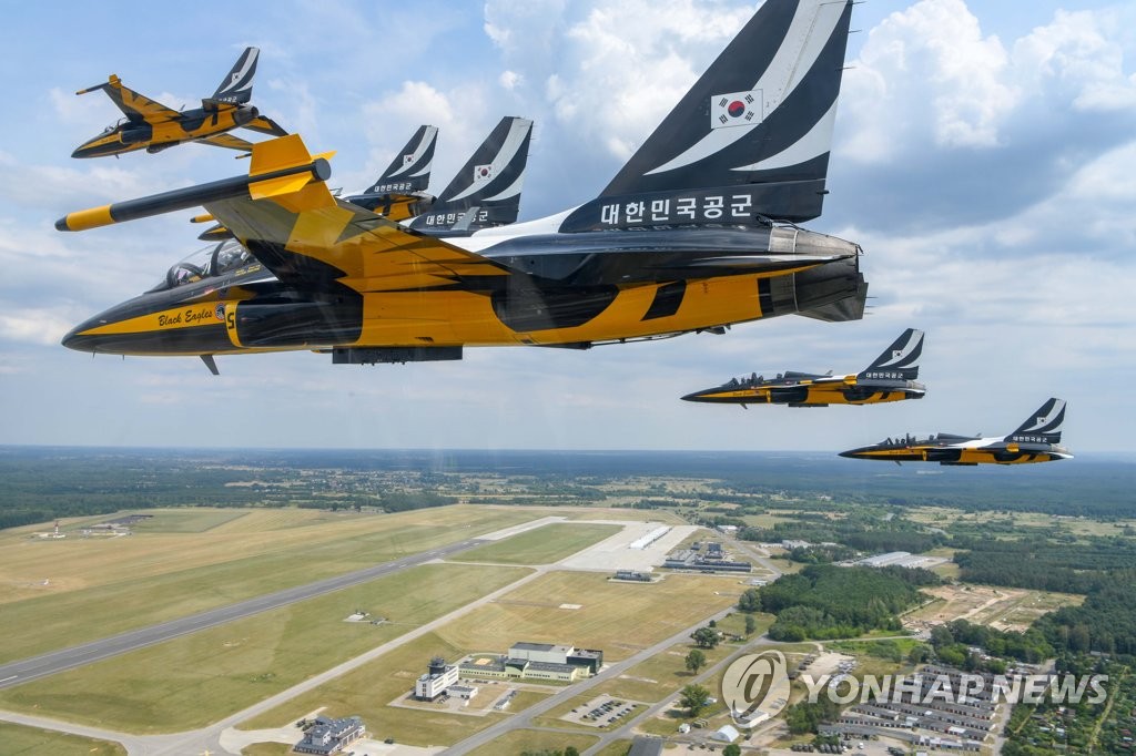 The South Korean Air Force's Black Eagles aerobatic flight team stages an aerial performance featuring the T-50 trainer jets in Deblin, about 120 kilometers southeast of Warsaw, on July 27, 2022, in this photo provided by the Air Force. (PHOTO NOT FOR SALE) (Yonhap)