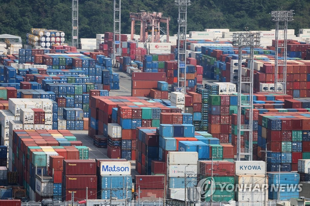Containers are stacked at a pier in South Korea's largest port city of Busan on July 2, 2023. (Yonhap)