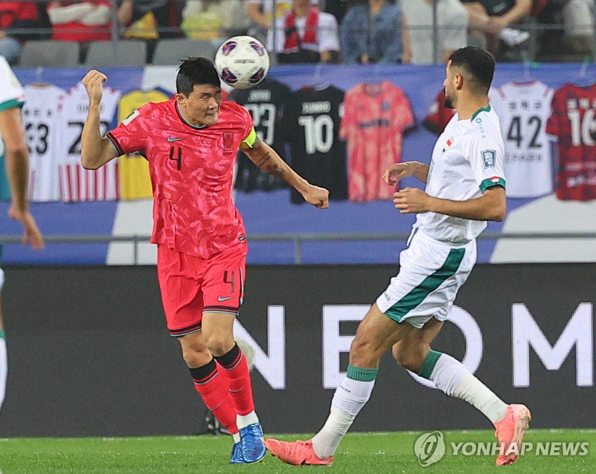 Kim Min-jae of South Korea (L) heads the ball against Iraq during the teams' Group B match in the third round of the Asian World Cup qualification at Yongin Mireu Stadium in Yongin, Gyeonggi Province, on Oct. 15, 2024. (Yonhap)