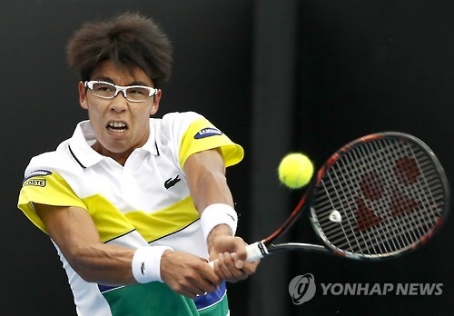 In this Associated Press photo, Chung Hyeon of South Korea hits a backhand return to Renzo Olivo of Argentina during their first round match at the Australian open in Melbourne on Jan. 17, 2017. (Yonhap)