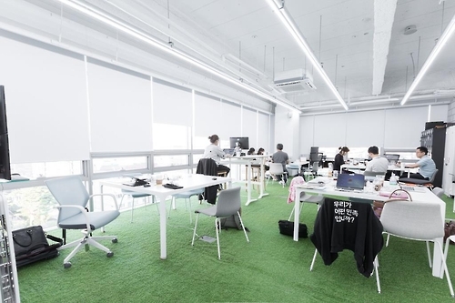 Employees work at the headquarters of Woowabrothers Co., a leading South Korean startup that operates the country's most popular food delivery mobile app, "Baedal Minjok," which means "Delivery Nation" in English. (Photo courtesy of Woowabrothers Co.) (Yonhap)