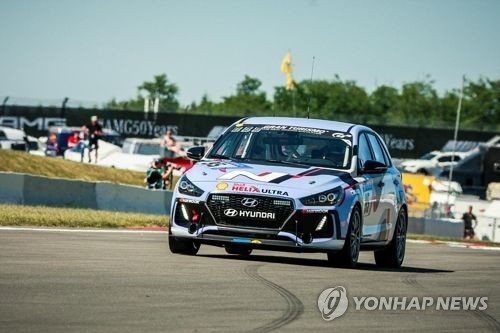 In this updated captured image from Yonhap News TV, Hyundai's i30N high-performance car runs the 2017 24 Hours Nurburgring, an endurance race held in Germany last weekend. (Yonhap)