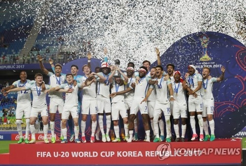 England's under-20 national football team players celebrate at Suwon World Cup Stadium in Suwon, Gyeonggi Province, on June 11, 2017, after winning the FIFA U-20 World Cup in South Korea. (Yonhap) 