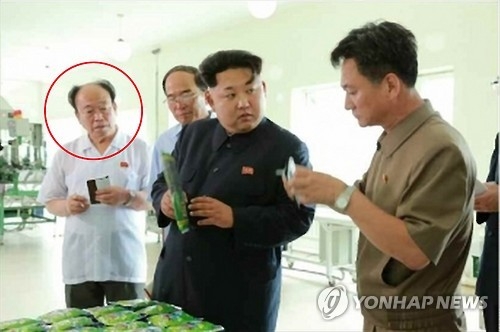 This photo carried by North Korea's media on July 11, 2015, shows Jon Il-chun (red circle), the head of Office 39, the ruling party's special unit managing state coffers. (For Use Only in the Republic of Korea. No Redistribution) (Yonhap)