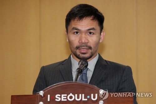 In this photo taken Dec. 26, 2017, Filipino boxer and senator Manny Pacquiao speaks at Seoul City Hall after he was named a global ambassador for the South Korean capital. (Yonhap) 