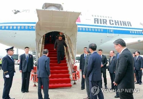 In this photo released by North Korea's media, leader Kim Jong-un arrives at a Singaporean airport on June, 10, 2018. (For Use Only in the Republic of Korea. No Redistribution) (Yonhap)