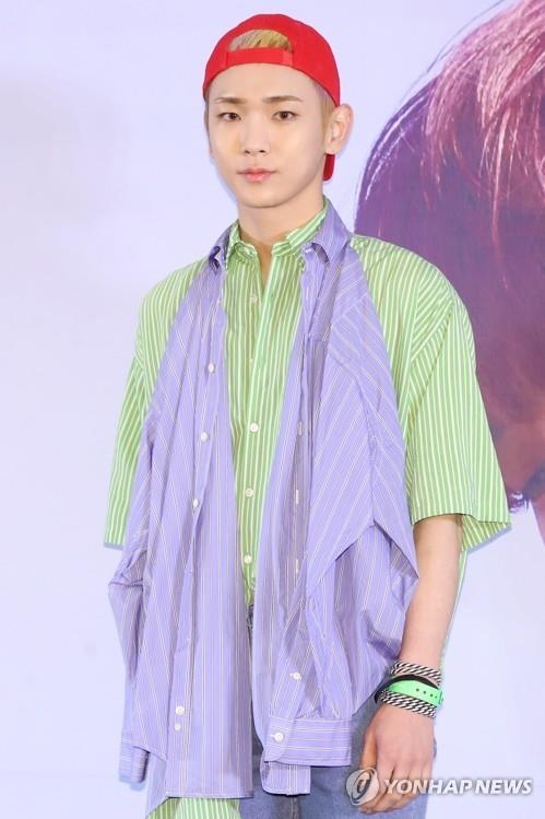 SHINee member Key poses for photos during a press conference in Seoul on June 11, 2018. (Yonhap)