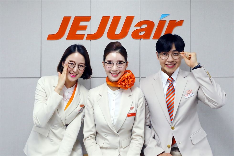 This promotional image provided by Jeju Air shows its flight attendants wearing glasses. (Yonhap) 
