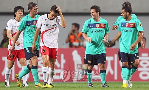 This file photo, taken Aug. 4, 2010, shows FC Barcelona's Lionel Messi (2nd from R) celebrating with teammates after scoring a goal against the K League All-Star team during a friendly match at Seoul World Cup Stadium in Seoul. (Yonhap)