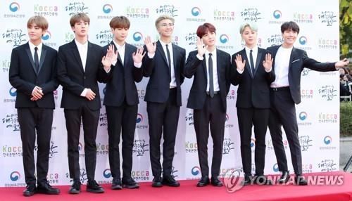 This photo shows the seven BTS members during a red carpet event. (Yonhap)