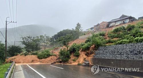 A road in Sancheong, South Gyeongsang Province, is closed to traffic on July 13, 2020, after being hit by a landslide caused by heavy rain, in this photo provided by the provincial government. (PHOTO NOT FOR SALE) (Yonhap)