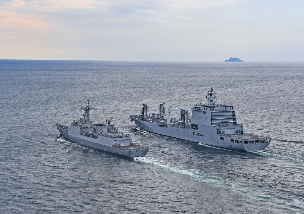 This photo provided by the Navy on Oct. 14, 2020, shows the 4,400-ton destroyer Kang Gam-chan (L) and the 10,000-ton logistics support ship Soyang. (PHOTO NOT FOR SALE) (Yonhap)