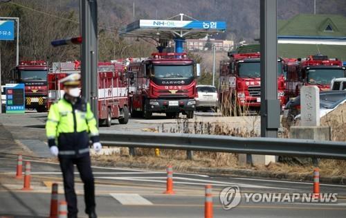 Firetrucks are ready to be deployed in Andong, North Gyeongsang Province, on Feb. 22, 2021. (Yonhap)