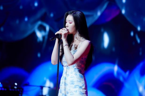 This image, provided by Abyss Company, shows Sunmi performing "What the Flower" during an online media showcase on Feb. 23, 2021. (PHOTO NOT FOR SALE) (Yonhap)