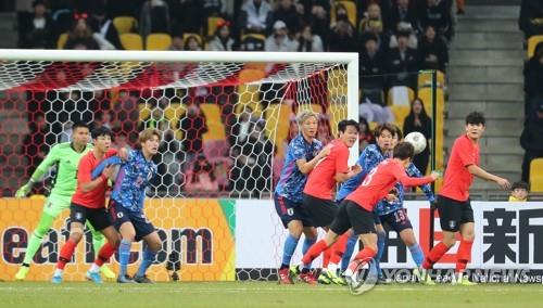 In this file photo from Dec. 18, 2019, South Korea (in red tops) and Japan are in action in the final of the East Asian Football Federation (EAFF) E-1 Football Championship at Busan Asiad Main Stadium in Busan, 450 kilometers southeast of Seoul. (Yonhap)