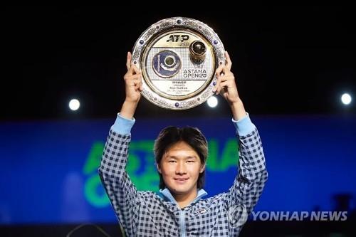 In this photo from the Facebook account of the Kazakhstan Tennis Federation, South Korean Kwon Soon-woo poses with the trophy after winning the ATP Tour Astana Open in Nur-Sultan on Sept. 26, 2021. (PHOTO NOT FOR SALE) (Yonhap)