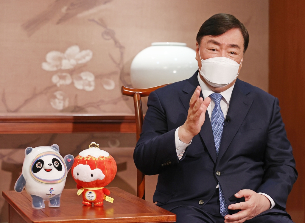 Xing Haiming, Chinese ambassador to South Korea, speaks during an interview with Yonhap News Agency at the Chinese embassy in Seoul on Jan. 4, 2022, alongside official mascots of the Beijing Winter Olympics scheduled to open Feb. 4. (Yonhap)