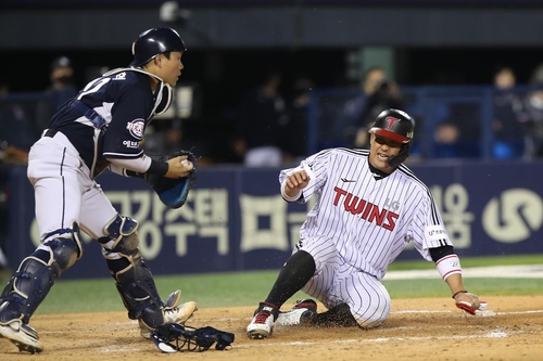 Catcher Park Sei-Hyok of Doosan Bears celebrates after hitting a