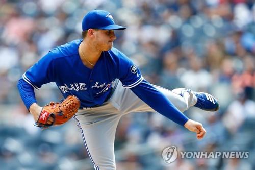 In this Getty Images file photo from Sept. 16, 2018, Thomas Pannone of the Toronto Blue Jays pitches against the New York Yankees in the bottom of the first inning of a Major League Baseball regular season game at Yankee Stadium in New York. (Yonhap)