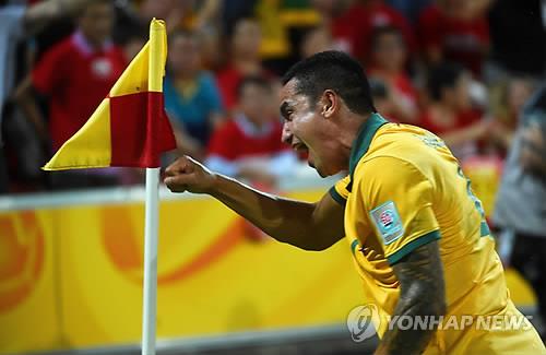 In this EPA file photo from Jan. 22, 2015, Tim Cahill of Australia celebrates his goal against China during the quarterfinal match of the Asian Football Confederation Asian Cup at Brisbane Stadium in Brisbane, Australia. (Yonhap)