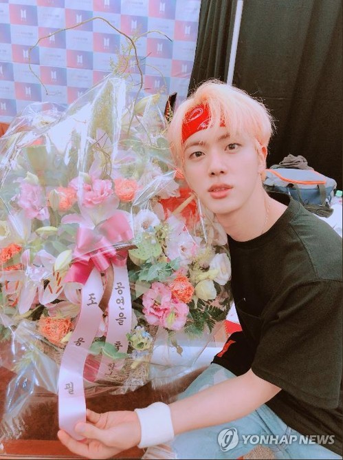 A photo of BTS member Jin, captured from the group's official Twitter (PHOTO NOT FOR SALE) (Yonhap)