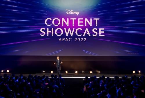 Luke Kang, president of The Walt Disney Co. Asia Pacific, introduces new movies and series during the Disney Content Showcase held at Marina Bay Sands in Singapore on Nov. 30, 2022, in this photo provided by Disney. (PHOTO NOT FOR SALE) (Yonhap)