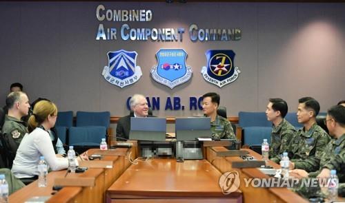 This photo, released by the South Korean Air Force, shows Air Force Chief of Staff Gen. Jung Sang-hwa speaking with U.S. Air Force Secretary Frank Kendall at an air base in Pyeongtaek, 65 kilometers south of Seoul, on March 19, 2023. (PHOTO NOT FOR SALE) (Yonhap)