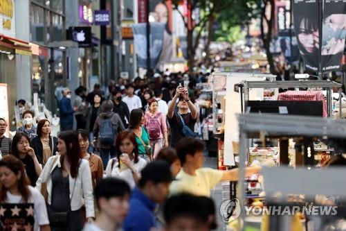 The central shopping district of Myeongdong, Seoul, is busy with visitors on May 14, 2023. (Yonhap)