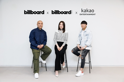 Billboard U.S. President Mike Van (L), Kim Yuna (C), the publisher and CEO of Billboard Korea, and Joseph Chang, co-CEO of Kakao Entertainment, are seen in this photo provided by the South Korean entertainment company. (PHOTO NOT FOR SALE) (Yonhap)