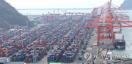 Containers are stacked at a port in South Korea's southeastern city of Busan, in this Feb. 3, 2025, file photo. (Yonhap)