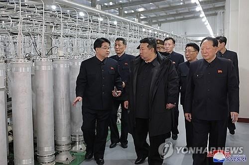 In this file photo, North Korean leader Kim Jong-un (C) inspects a nuclear-material production base with officials in this photo published by the Korean Central News Agency on Jan. 29, 2025. (For Use Only in the Republic of Korea. No Redistribution) (Yonhap)