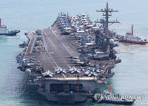 This file photo, taken March 7, 2025, shows the USS Carl Vinson aircraft carrier leaving a major naval base in Busan, about 320 kilometers southeast of Seoul. (Yonhap) This file photo, taken March 7, 2025, shows the USS Carl Vinson aircraft carrier leaving a major naval base in Busan, about 320 kilometers southeast of Seoul. (Yonhap)